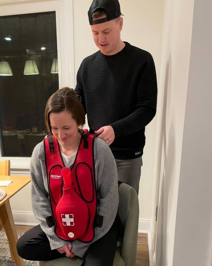 Instructor demonstrating a choking rescue training vest